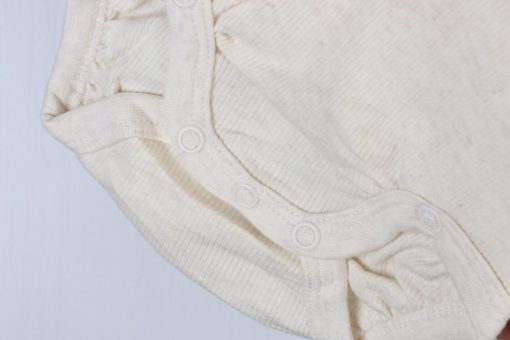 بادی آستین بلند برند H&M طرح کبریتی شیری - Image 3