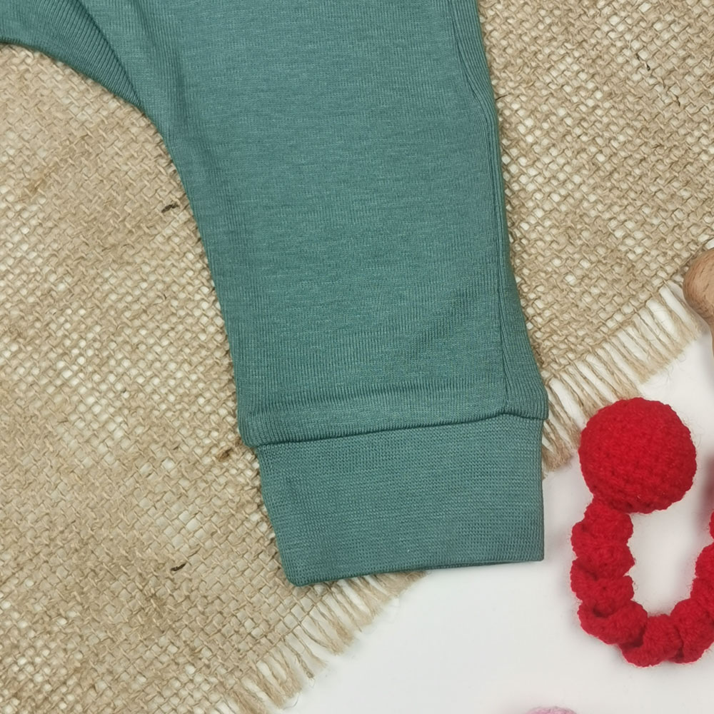 شلوار نوزادی اسلش برند h and m کمرکش سبز تیره رنگ - 2 تا 4 ماه