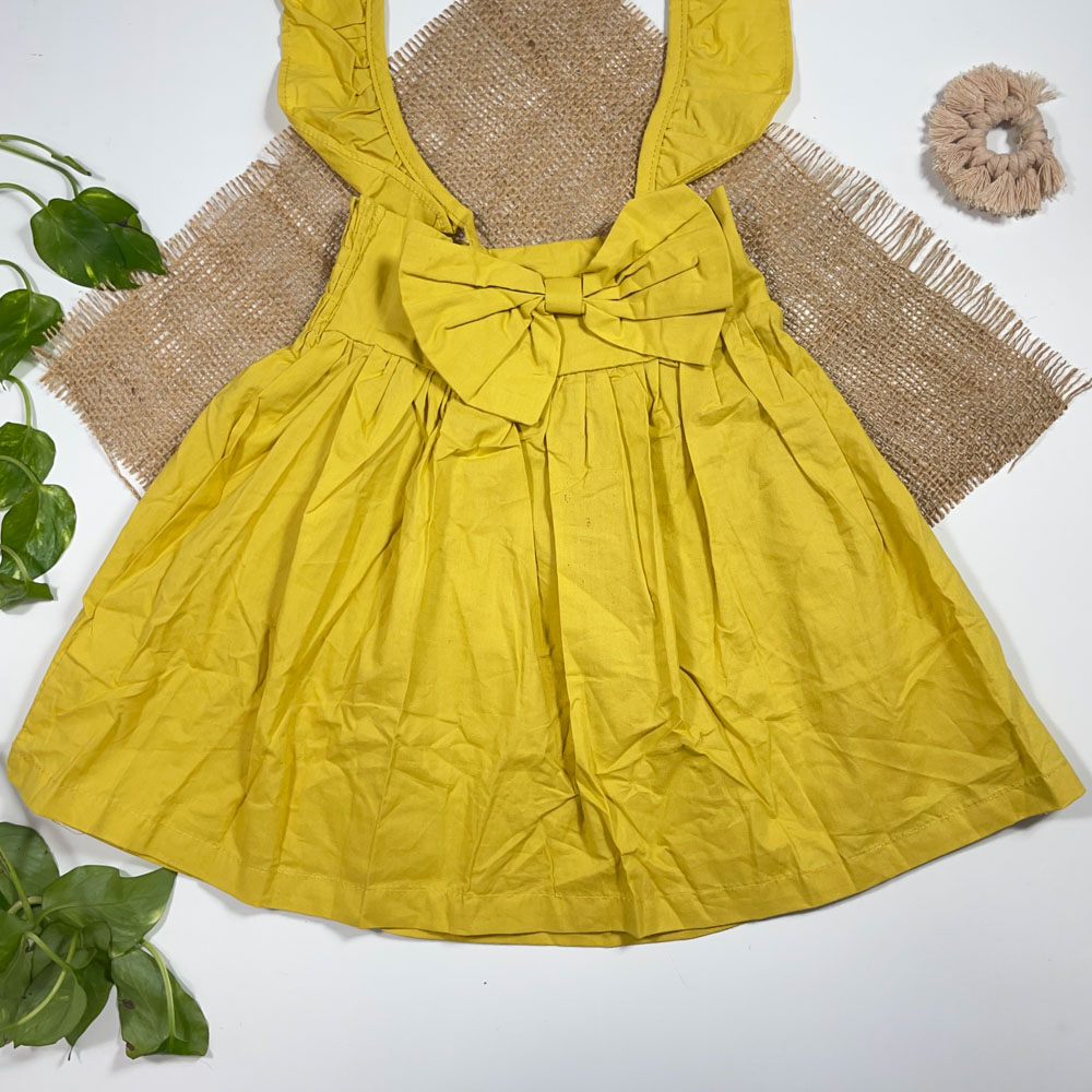 بلوز دامنی دخترانه آستین بلند طرح پاپیونی بند دار زرد رنگ - 2 تا 4 سال