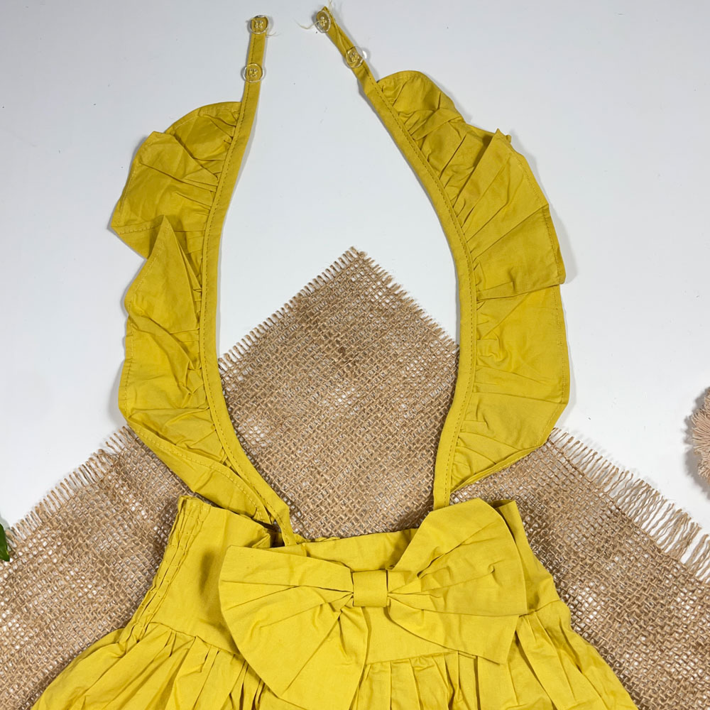 بلوز دامنی دخترانه آستین بلند طرح پاپیونی بند دار زرد رنگ - 2 تا 4 سال