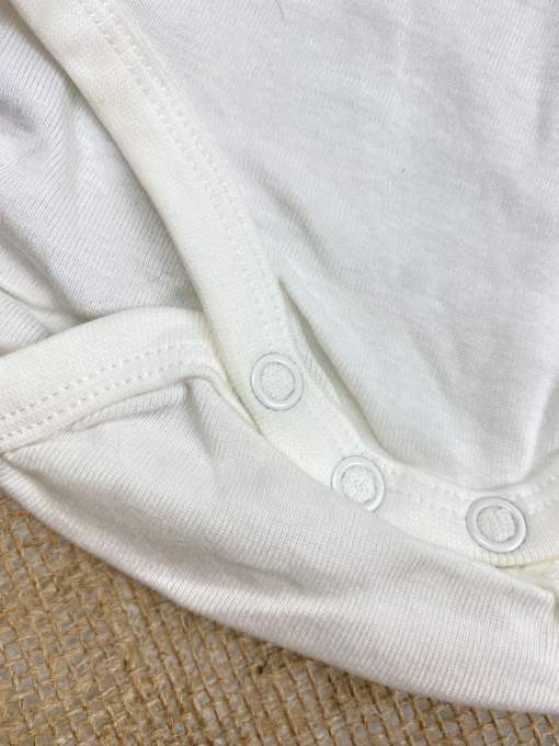 ایراد دار _ بادی نوزادی آستین بلند طرح تدی یقه گرد سفید رنگ - 2 تا 3 ماه