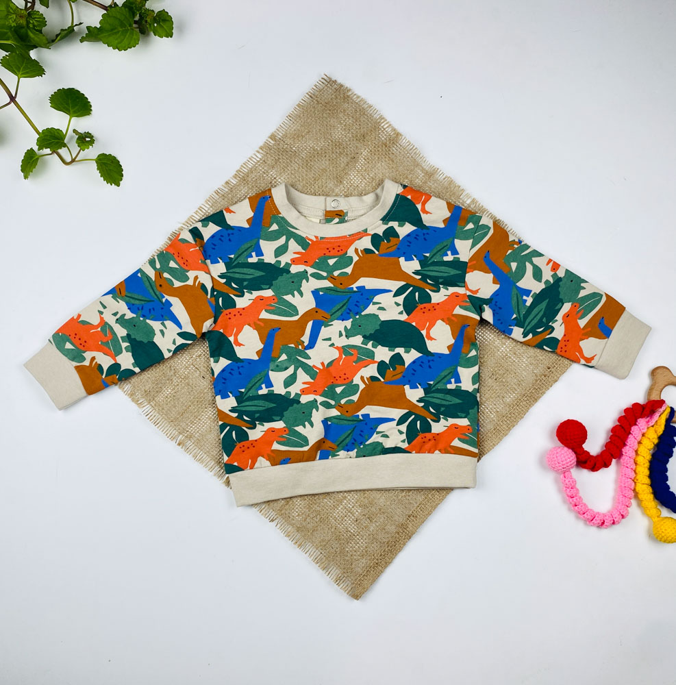 بلوز نوزادی آستین بلند برند لوپیلو طرح تمساح و دایناسور ها یقه گرد پشت دکمه ای کرم رنگ - 6 تا 12 ماه