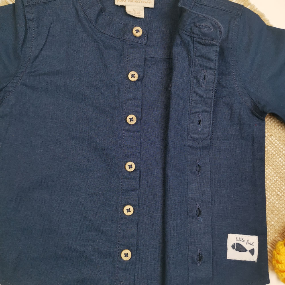 بلوز نوزادی پسرانه آستین بلند برند لوپیلو طرح دکمه ای جیب دار سرمه ای رنگ